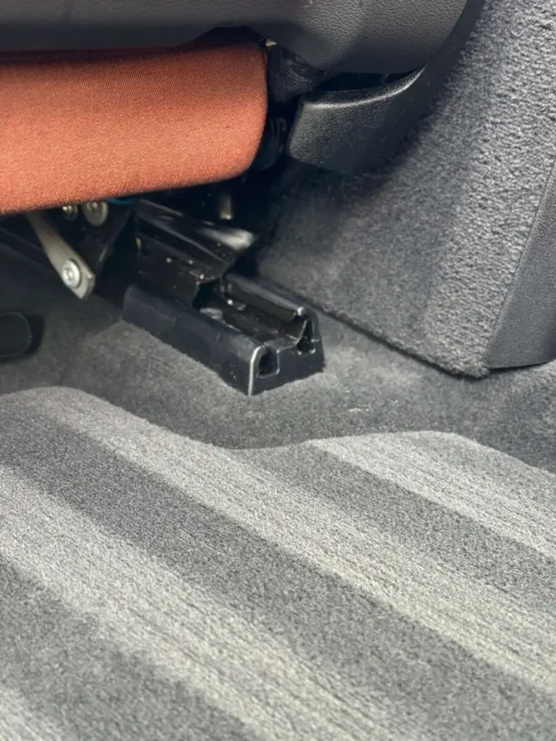 Vehicle interior after professional detailing, showcasing clean carpet, seats, and crevices with a factory-fresh look in Fort Wayne, Indiana.