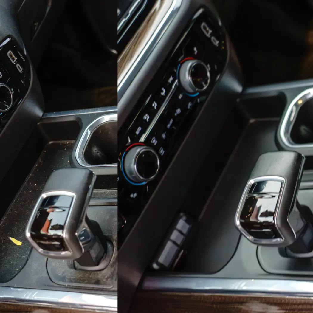 Close-up of a car's interior center console featuring a gear shift and climate control knobs.