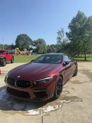 Burgundy BMW M8 clean and glossy after an exterior detail