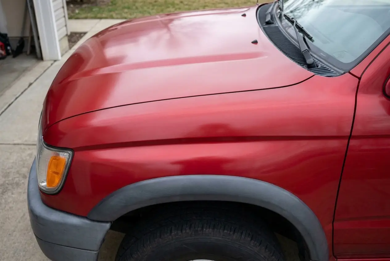 SUV fender after correction, restored gloss and depth