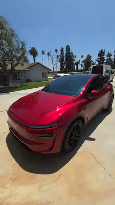 Red Tesla Model Y after a documented maintenance detail in Riverside, CA