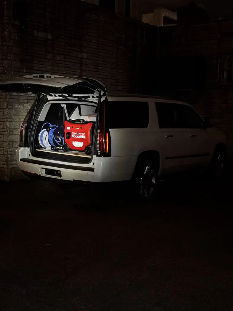 The Detail Department mobile detailing van setup with generator and hose reel