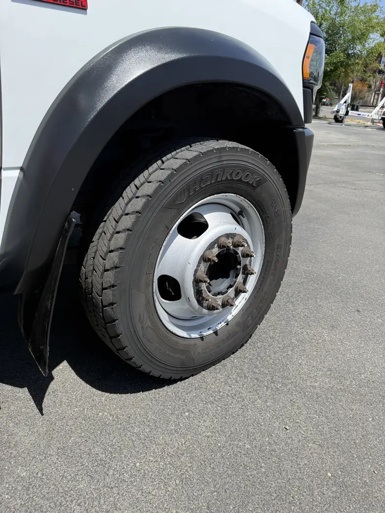 Same truck wheel after deep clean — chrome shining and tire dressed
