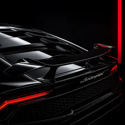 Black Lamborghini rear detail with red accent lighting after luxury detailing