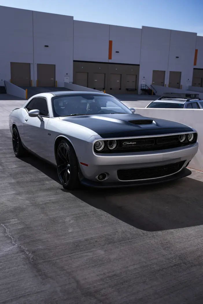 Silver Dodge Challenger with a matte black hood after ceramic coating in Mesa, Arizona